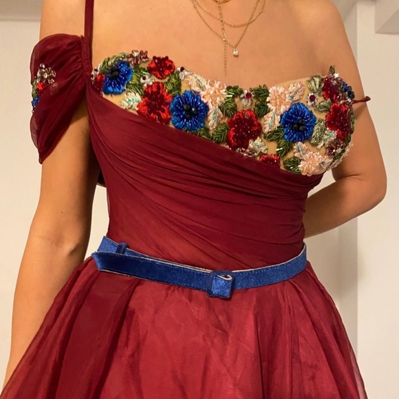 Teuta Matoshi Elegant Burgundy Evening Gown with Embroidered Floral Accents - Picture 7 of 8